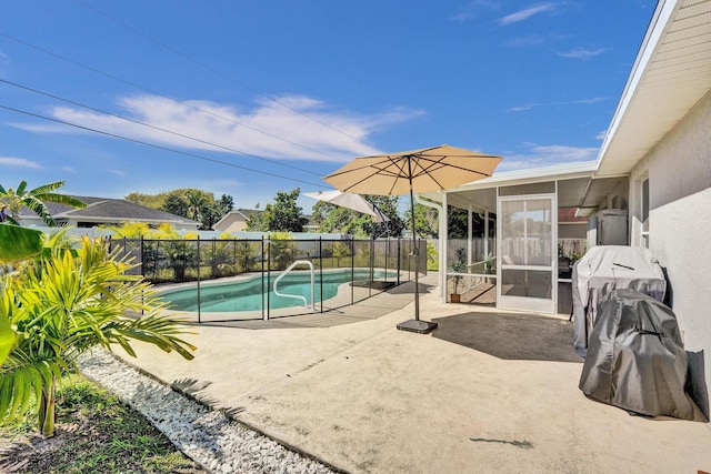 view of pool with a patio, fence, a fenced in pool, and a sunroom