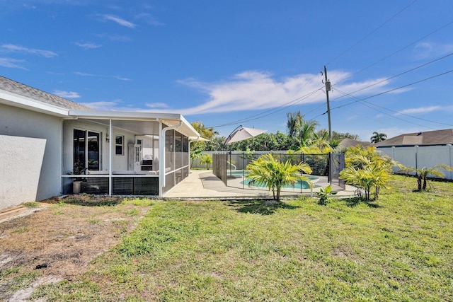 view of yard featuring a patio, a fenced backyard, a fenced in pool, and a sunroom