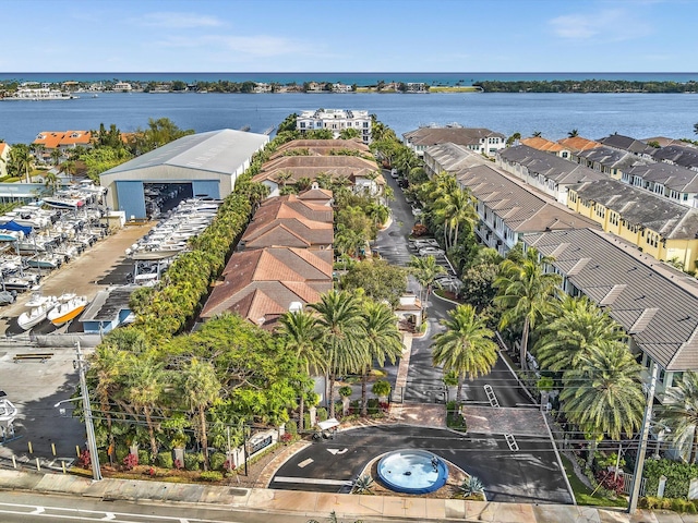 bird's eye view featuring a residential view and a water view