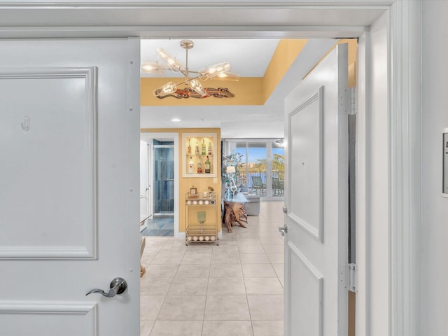 corridor featuring light tile patterned floors