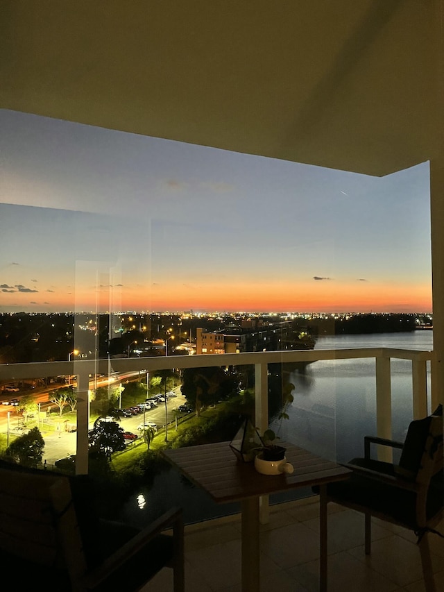 balcony at dusk with a water view