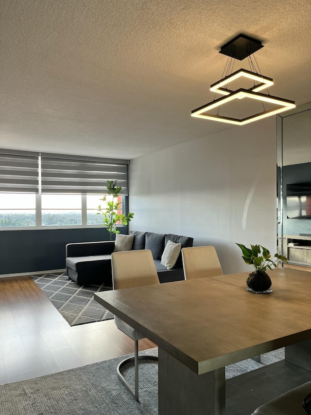 dining area featuring a textured ceiling