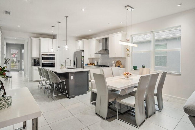 dining area with recessed lighting, visible vents, baseboards, and light tile patterned floors