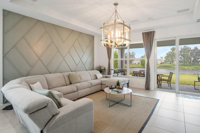 living area featuring light tile patterned floors, an accent wall, and a wealth of natural light