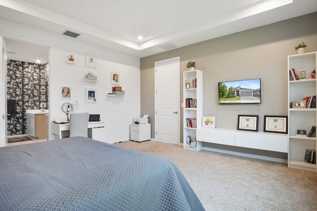 carpeted bedroom with recessed lighting, a raised ceiling, and visible vents