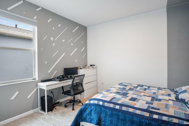 carpeted bedroom featuring baseboards