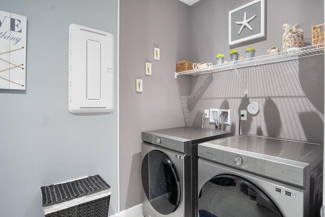 washroom featuring laundry area and washer and dryer