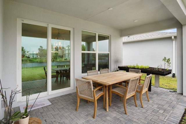 view of patio featuring outdoor dining area