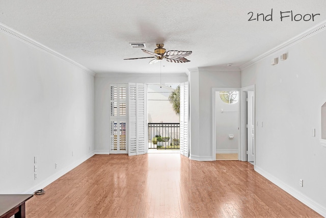 unfurnished room with a textured ceiling, ornamental molding, wood finished floors, and ceiling fan