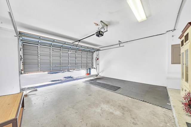 garage featuring electric panel and a garage door opener