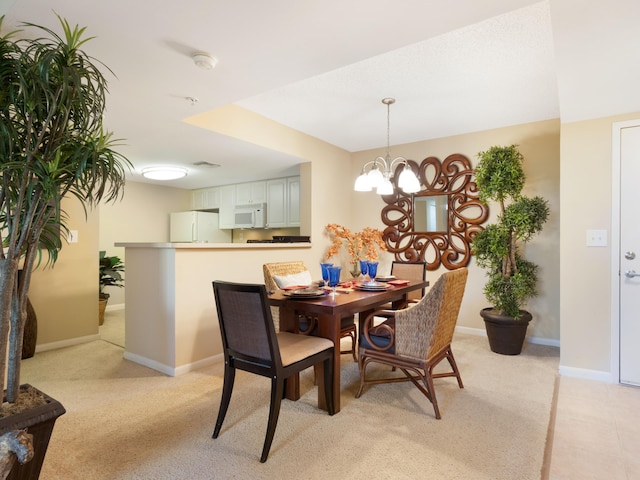 520 SE 5th Ave Unit 2405, Fort Lauderdale, FL 33301 - dining area featuring baseboards and a notable chandelier
