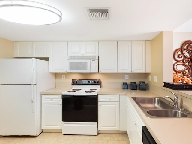 520 SE 5th Ave Unit 2405, Fort Lauderdale, FL 33301 - kitchen with white appliances, visible vents, light countertops, and a sink