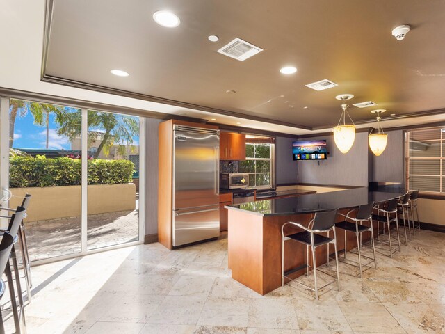 520 SE 5th Ave Unit 2405, Fort Lauderdale, FL 33301 - kitchen with visible vents, dark countertops, a raised ceiling, and stainless steel appliances