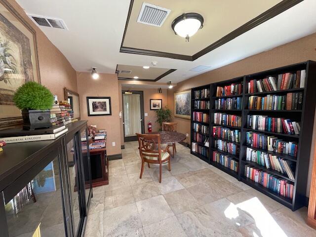 520 SE 5th Ave Unit 2405, Fort Lauderdale, FL 33301 - office area with bookshelves and visible vents