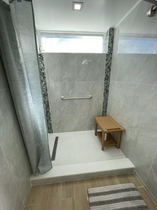 bathroom featuring visible vents and tiled shower