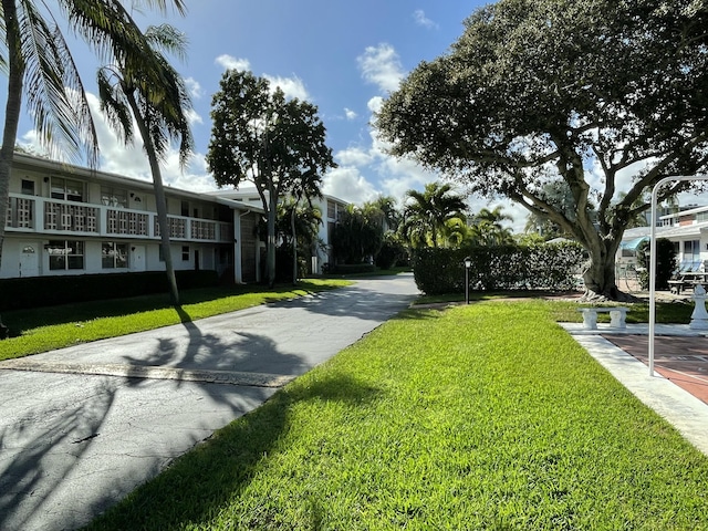 view of home's community with a lawn