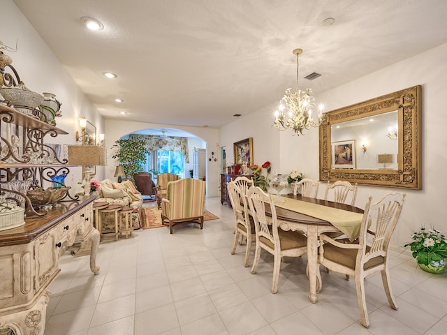 dining room featuring arched walkways, visible vents, recessed lighting, and an inviting chandelier