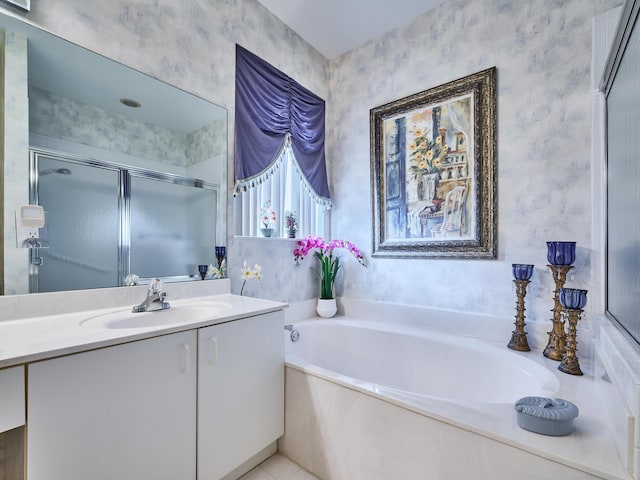 full bath with a stall shower, wallpapered walls, a bath, and vanity