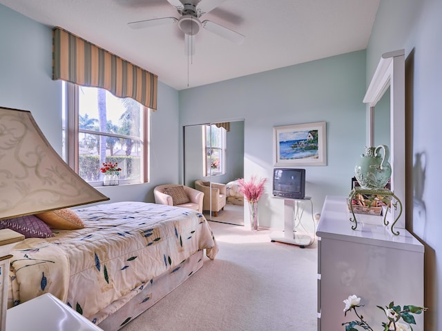 carpeted bedroom with ceiling fan