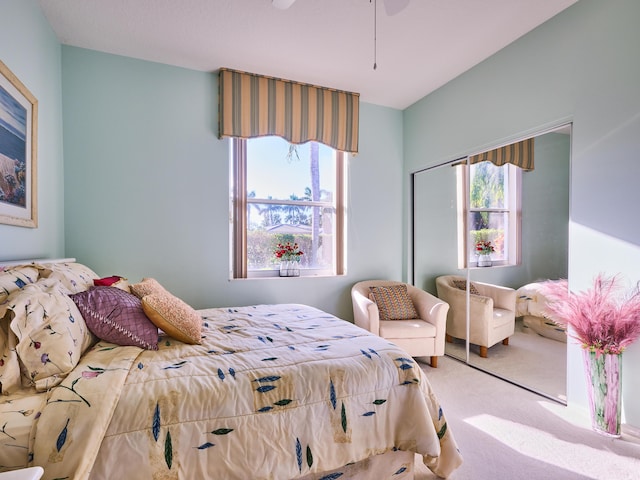 bedroom featuring carpet, a closet, and ceiling fan