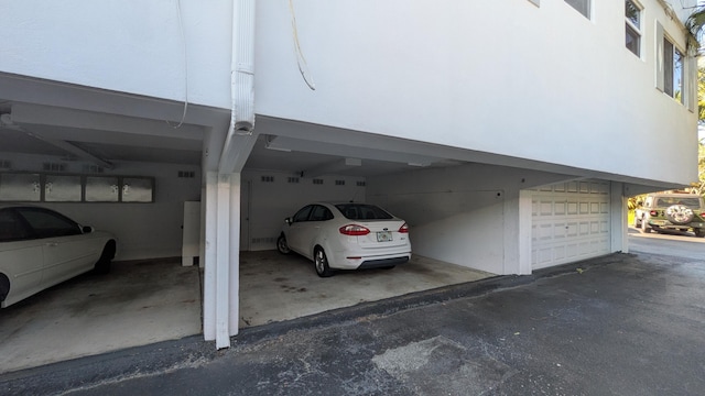 view of parking with a garage