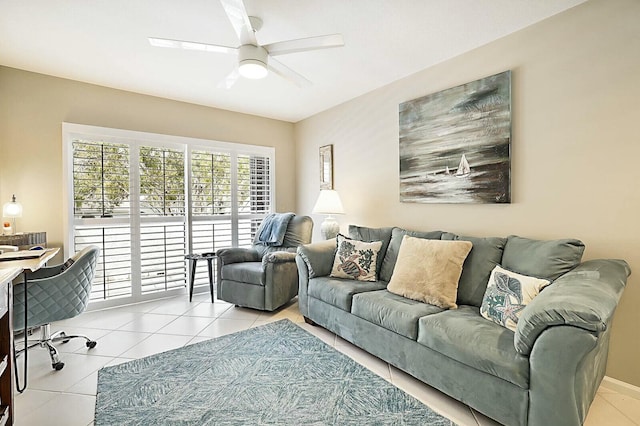 living area with ceiling fan and light tile patterned flooring