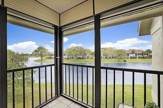 balcony featuring a water view