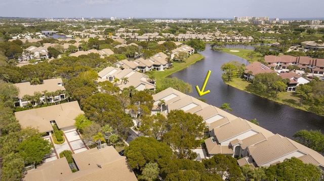 birds eye view of property with a water view and a residential view