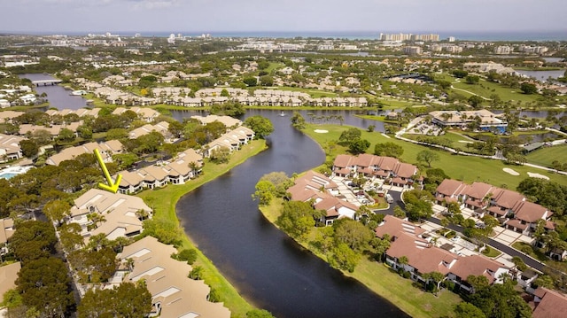 birds eye view of property featuring a water view and a residential view