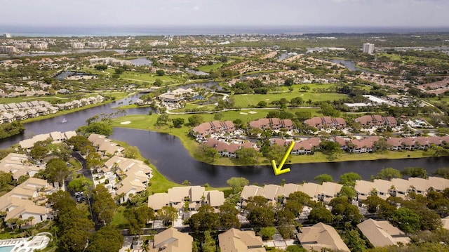 bird's eye view featuring a water view and a residential view