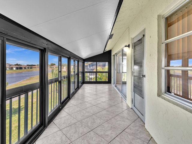 unfurnished sunroom featuring lofted ceiling