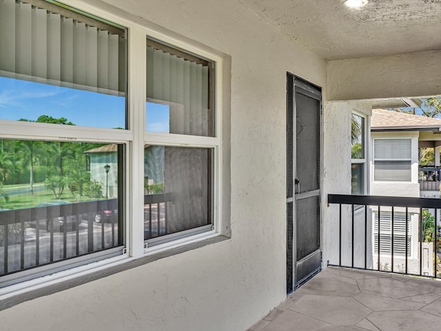 doorway to property with stucco siding