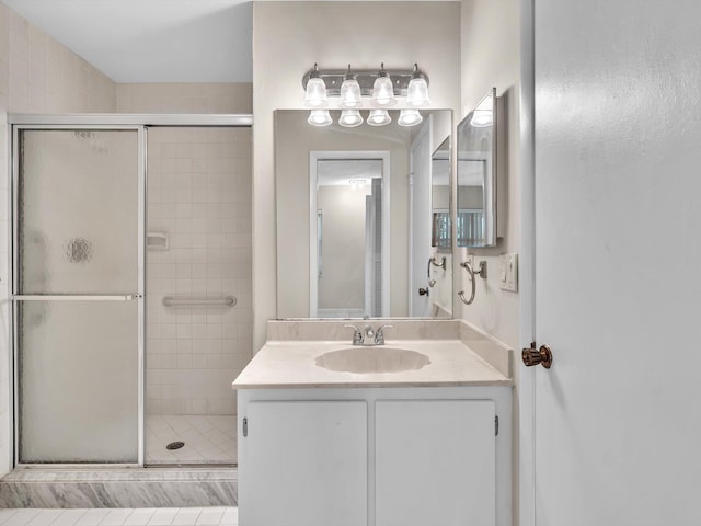 full bathroom with vanity and a stall shower