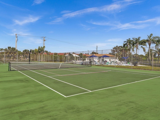 view of sport court featuring fence