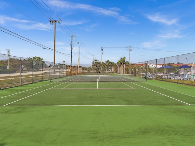 view of sport court with fence