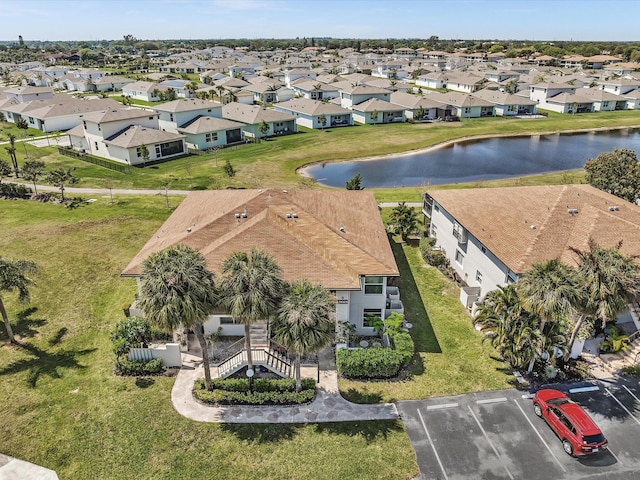 aerial view with a residential view and a water view