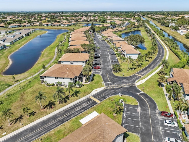 birds eye view of property with a residential view and a water view