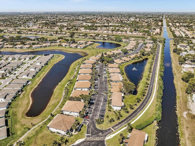 aerial view with a residential view and a water view