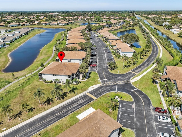 aerial view featuring a residential view and a water view