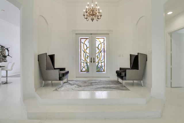 tiled entryway featuring arched walkways, french doors, crown molding, an inviting chandelier, and baseboards