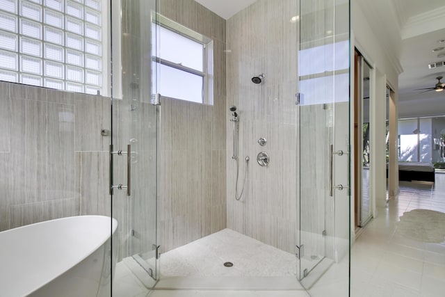 bathroom with a stall shower, tile patterned flooring, visible vents, and a freestanding bath