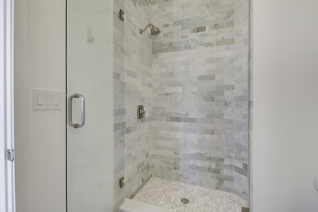 full bath featuring a shower stall