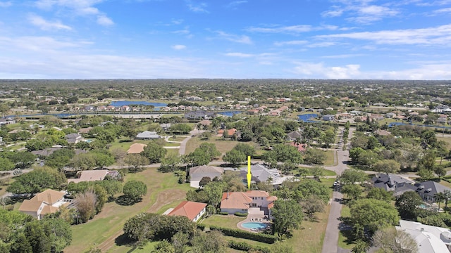 bird's eye view featuring a water view and a residential view