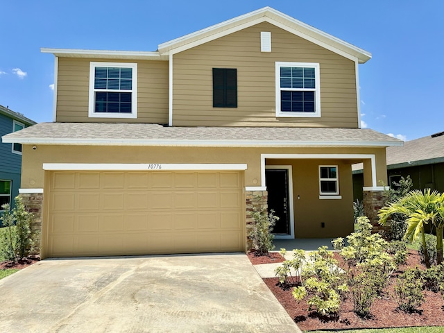 craftsman-style home featuring driveway, stone siding, a shingled roof, and a garage