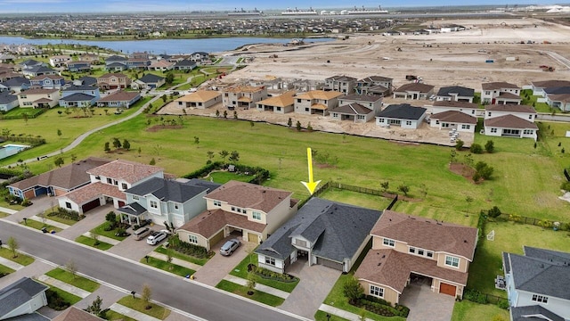 bird's eye view featuring a residential view and a water view