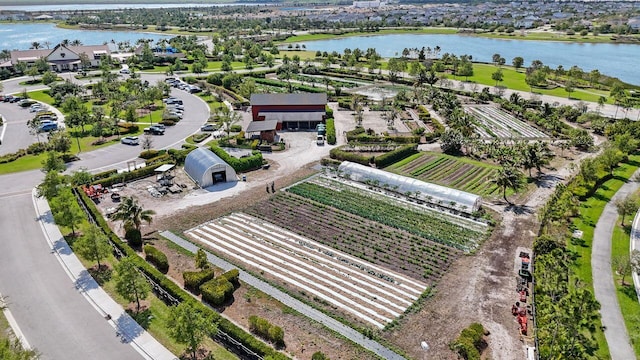 bird's eye view with a rural view and a water view