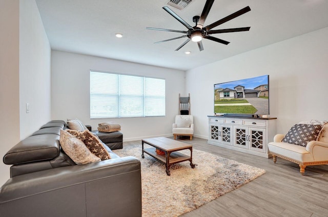 living area featuring visible vents, baseboards, ceiling fan, recessed lighting, and wood finished floors