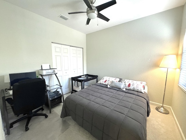 carpeted bedroom featuring a closet, visible vents, ceiling fan, and baseboards