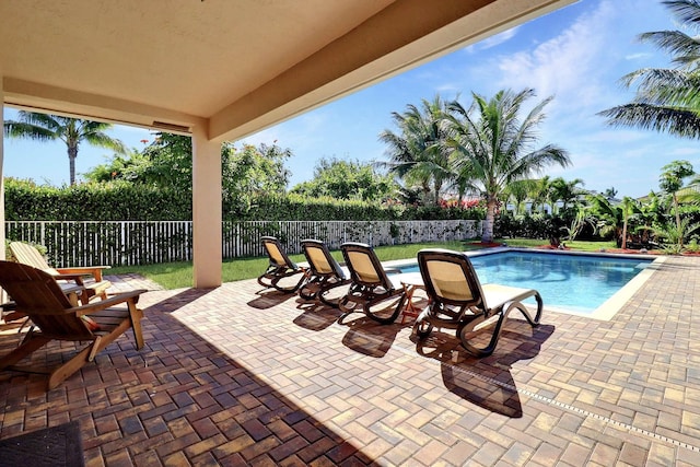 view of swimming pool with a patio area, a fenced in pool, and a fenced backyard