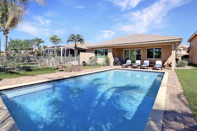 view of swimming pool with a fenced in pool, a patio, and fence